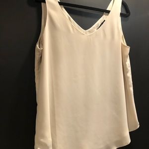 Melanie Lyne sleeveless lined cream coloured top.